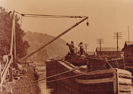 This photograph shows a canal boat unloading jute at the Lambertville Paper Mill.  The mill produced a variety of products, including paper insulation used for electrical wiring.  (Photograph courtesy of William McKelvey, Jr.)